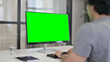 © stockbakers - Businessman Using Desktop with Green Chroma Key Screen