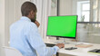 © stockbakers - Businessman Celebrating While Using Desktop with Green Chroma Key Screen