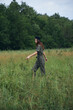 © SHOTPRIME STUDIO - Woman A tall grass landscape walks across the field