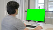© stockbakers - Businessman Using Desktop with Green Chroma Key Screen