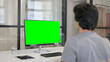 © stockbakers - Video Call by Businessman on Desktop with Green Chroma Key Screen,