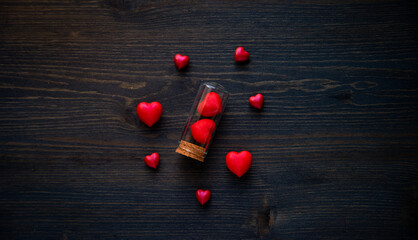 Wall Mural - red hearts in bottles for valentines day Greeting card. Flat lay, 