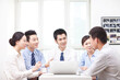 © eastfenceimage - Group of business people discussing in office