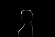 © Mihail - dark black background with silhouette of male woman