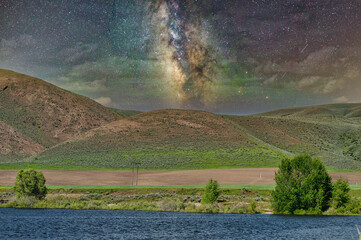 Poster - Mesmerizing view of beautiful mountains and blue sea under the milky way