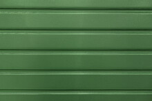 Abstract Background Of Green Embossed Plastic Surface Close Up