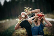 © MalteJaeger/Westend61 - Playful friends covering eyes while standing at farm