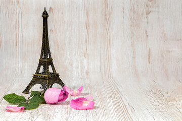 Valentine's Day. Rose and Eiffel Tower. Wooden background. Postcard.