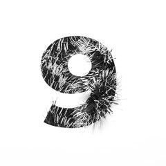 Black number nine made of tinsel and paper cut shape of ninth numeral isolated on white. Monochrome stylish digits