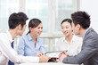 © eastfenceimage - Group of business people discussing in office