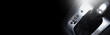 © Lalandrew - Top view of automatic gearbox selector on black background with copy space.