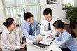 © eastfenceimage - Group of business people discussing in office