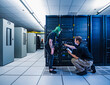 © Erik Isakson - Co-workers in data center server room