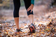© JOSEP SURIA/Westend61 - Sportswoman having cramp in leg while standing on forest path