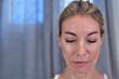 © victor espadas gonzalez/Westend61 - Mature woman with eyes closed at home
