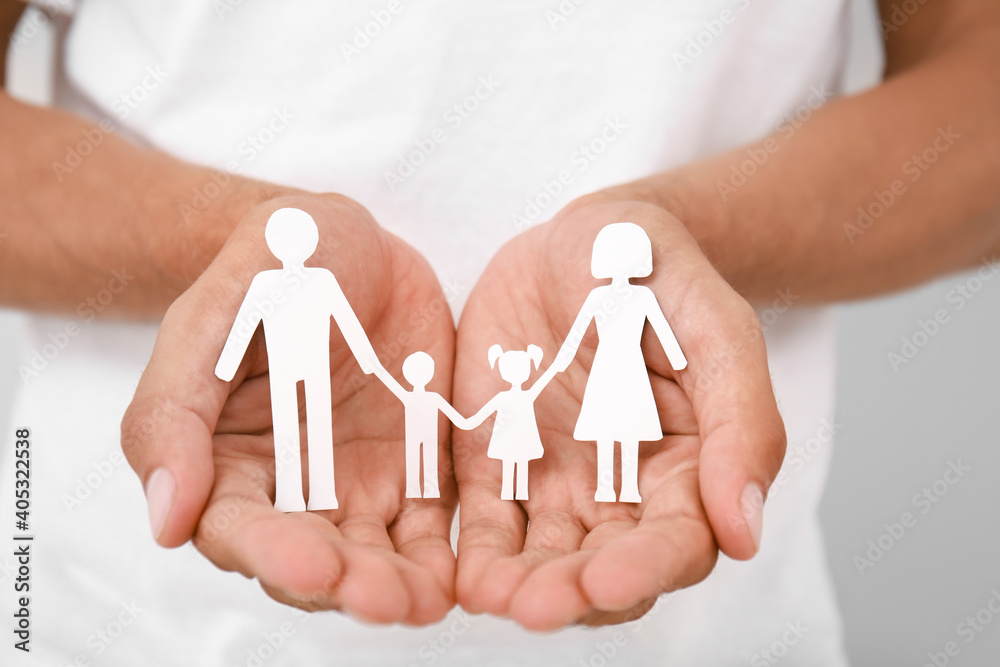 Hands of family with human figures