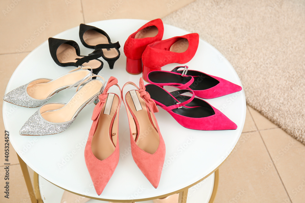 Different stylish shoes in modern store