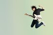 © BillionPhotos.com - Portrait of a musician man jumps while playing on guitar