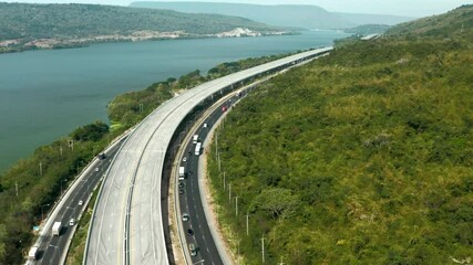 Wall Mural - Scenic aerial view of big highway, Top view from drone of road and green forest mountain 