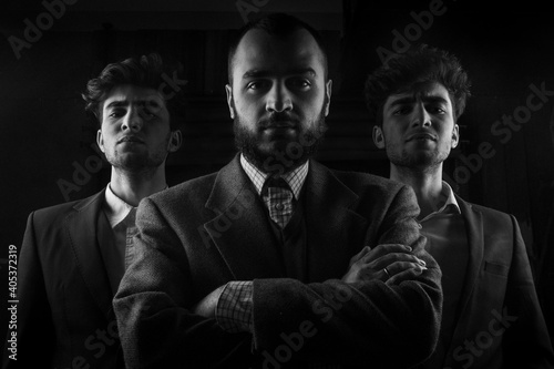 Fototapeta na szkło Portrait Of Businessmen Standing On Black Background