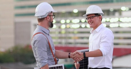 Wall Mural - Electrical Engineer Technician and CEO executive business people making handshake after meeting. clean and green alternative energy concept.