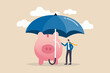 Insurance and finance saving protection in economy crisis, safety investment or all weather portfolio concept, confidence businessman investor with his piggy bank safety money covered by big umbrella.