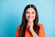 © deagreez - Portrait of charming person arm on chin look empty space thinking toothy smile isolated on blue color background