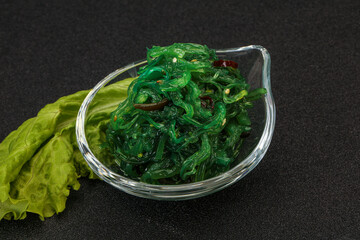 Green Chuka Seaweed Salad Isolated on White Background Top View. Wakame Sea Kelp Salat