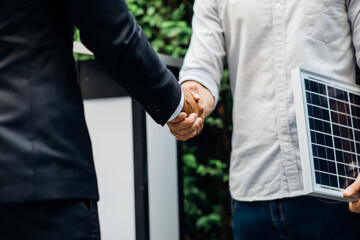 Wall Mural - Electrical Engineer Technician and CEO executive business people making handshake after meeting. clean and green alternative energy concept.