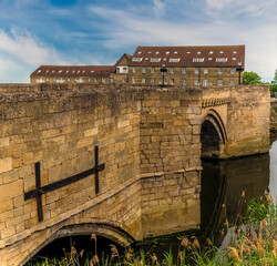 Wall Mural - A view of the Old Bridge at Riverside, Godmanchester, UK spanning the River Great Ouse in springtime