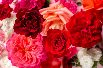 Wall Mural - Bouquet of beautiful multicolored rose flowers. Top view, selective focus.