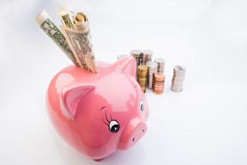 Pink Piggy Bank. Romanian currency, stack of coins