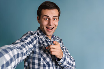 Sticker - Attractive smiling young man in checkered shirt