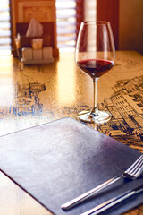 Glass of red wine on a table in a restaurant