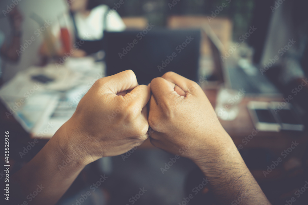 Cropped Image Of Colleagues Giving Fist Bump - obrazy, fototapety, plakaty 