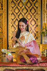 Wall Mural - Luxury portrait of a beautiful Thai girl in traditional thai costume, identity culture of Thailand, identity culture of Asia