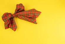 Red Bow Scottish Fabric On Yellow Background