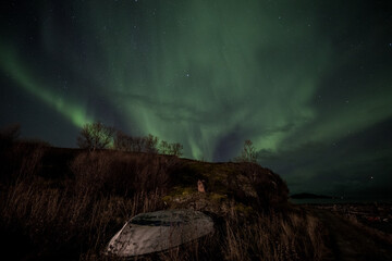 old boat under the aurora