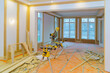 © ungvar - Construction remodeling home with circular saw cutting wood trim molding