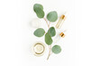 © K.Decor - Eucalyptus essential oil, eucalyptus leaves on white background. Natural, Organic cosmetics products. Medicinal plant. Natural Serums. Flat lay, top view.