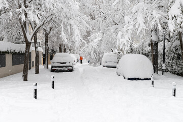 people enjoying the historical snowtorm over madrid city, spain.