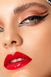 © Julia - Beautiful young  girl - makeup in retro style. Retro make-up - red lips, black arrows. closeup