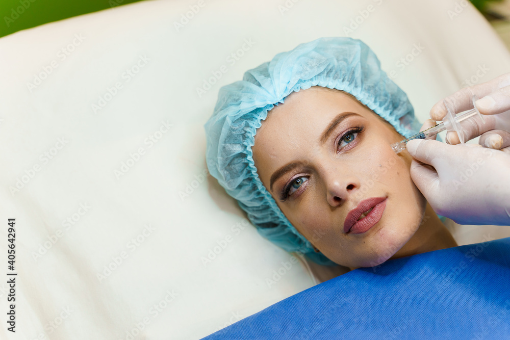 Filler injection in cheekbones. ?ontour plastic for correcting the ...