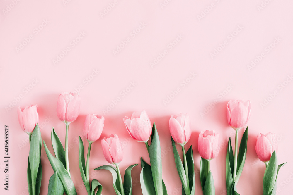 Beautiful composition spring flowers. Bouquet of pink tulips flowers on pastel pink background. Valentine's Day, Easter, Birthday, Happy Women's Day, Mother's Day. Flat lay, top view, copy space - obrazy, fototapety, plakaty 