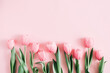 Leinwandbild Motiv Beautiful composition spring flowers. Bouquet of pink tulips flowers on pastel pink background. Valentine's Day, Easter, Birthday, Happy Women's Day, Mother's Day. Flat lay, top view, copy space