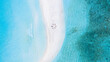 © AmazingAerialAgency - Aerial view of a group of women, doing yoga at a sandbank, Maldives.