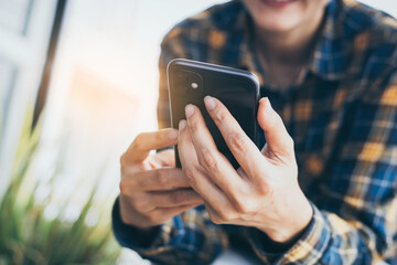 using cell phone hand holding mobile texting message contact us.chatting,search internet information