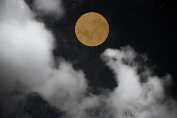  Full moon and clouds in the night.