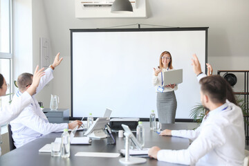 Poster - Team of doctors during meeting in modern clinic