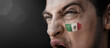 © butenkow - A screaming man with the image of the Mexico national flag on his face